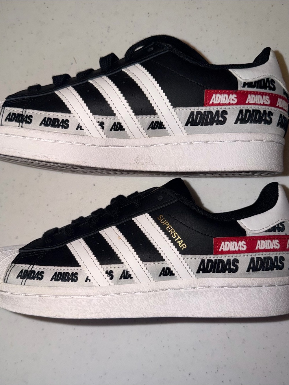 adidas Black & White Superstar Sneakers with Red Logo Tape